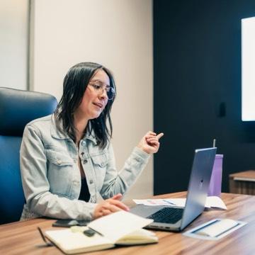 Marketer working on a laptop at her desk